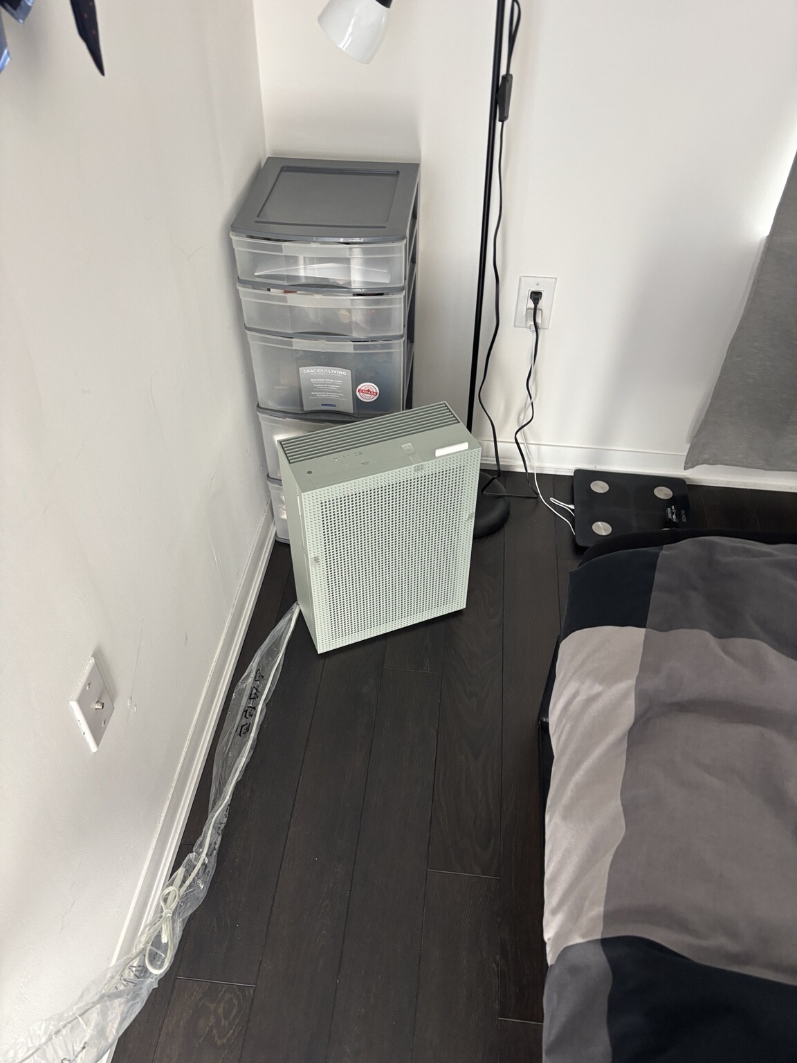 Coway Airmega 150C fitting between a bed and storage drawers